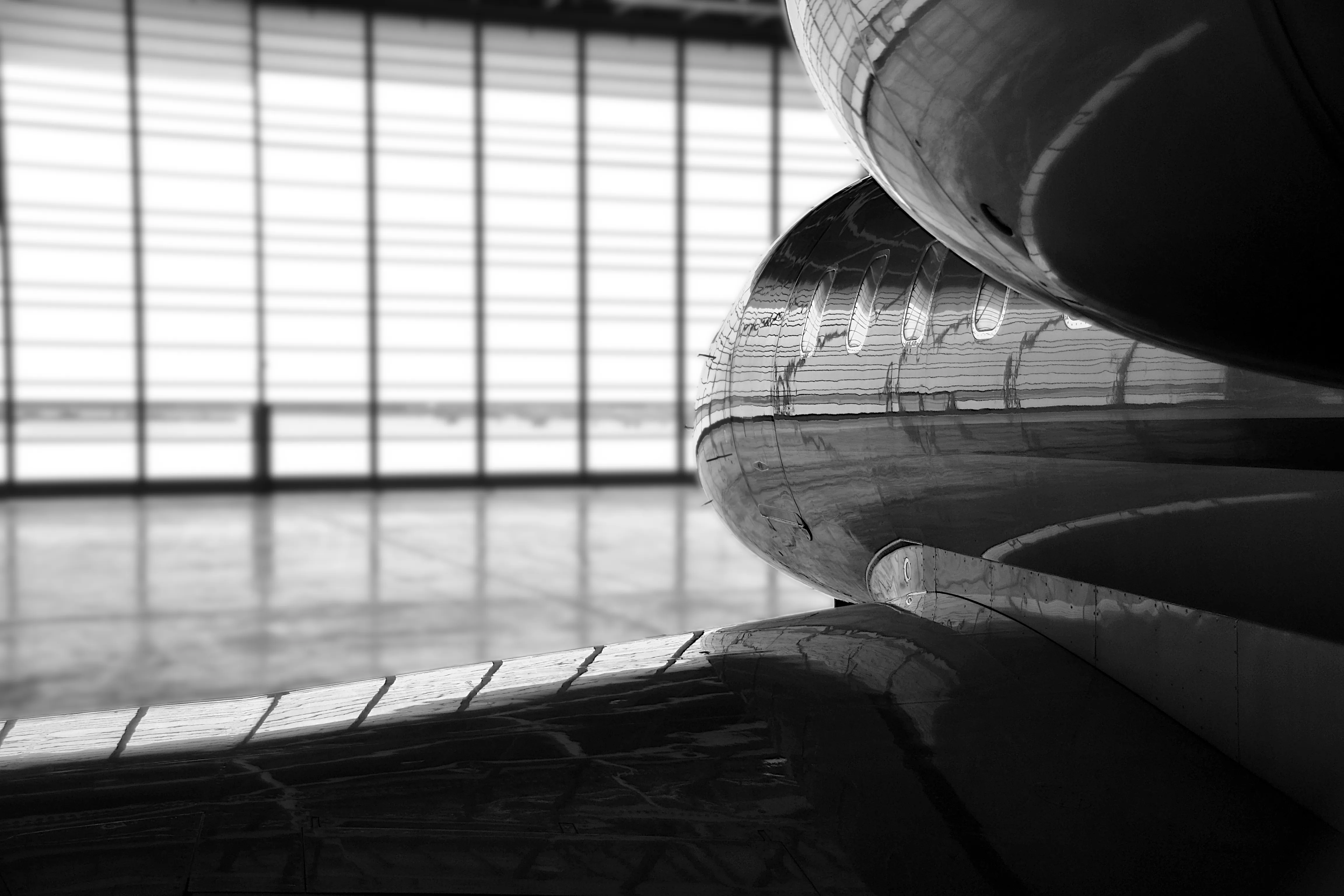 Business aircraft detail inside a maintenance hangar